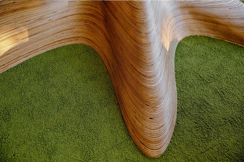 detailed plywood tree in an artificial grass mat